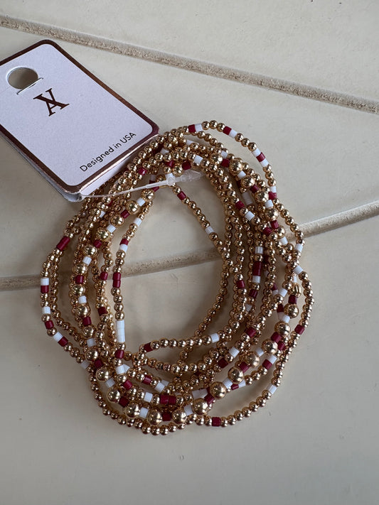 Set of 9 maroon/gold stretch bracelets