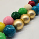 Closeup of colorful beads on a white background