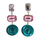 Pair of earrings with pink and blue crystal elements on a white background