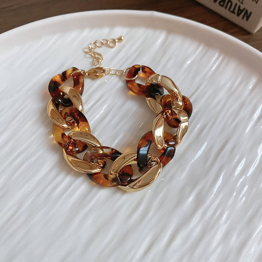 Interlocking oval gold/tort bracelet