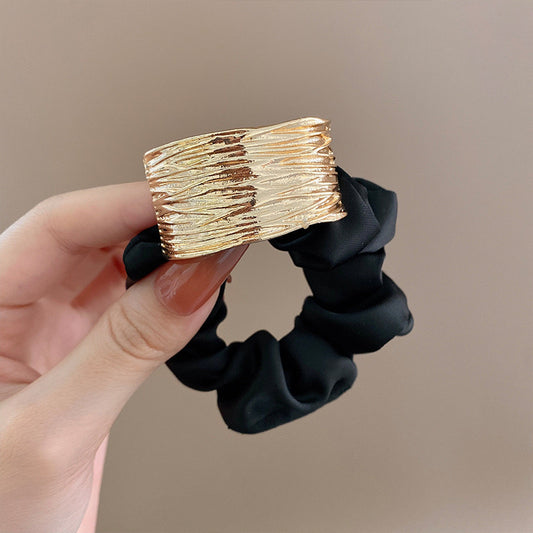 Solid metal accent hair tie