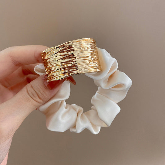 Solid metal accent hair tie