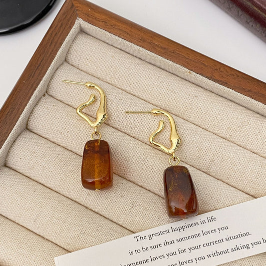 Asymmetrical hoop style tortoise earrings