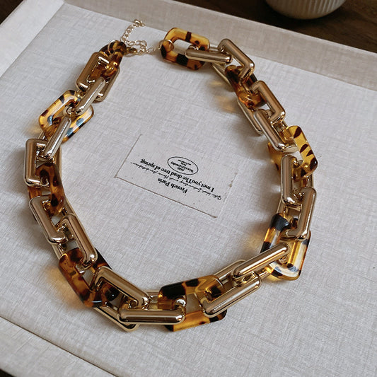 Interlocking gold/tort rectangular necklace