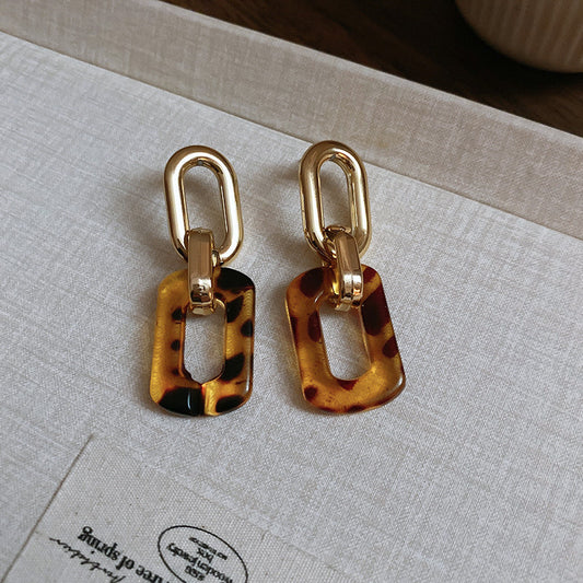 Interlocking rectangular gold/tort earrings