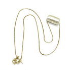 Gold necklace with a pendant on a white background