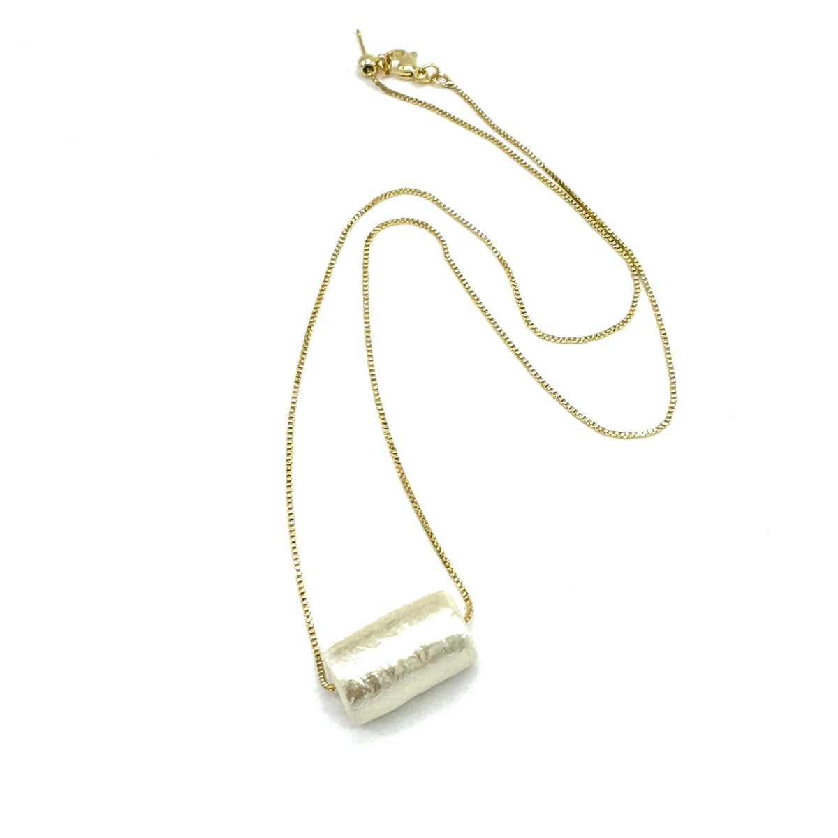 Necklace with a cylindrical pendant on a white background