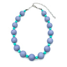 Adjustable necklace featuring chunky periwinkle lucite beads and smaller faceted turquoise spacers on a white background.