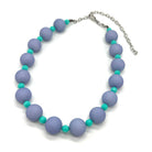 Adjustable necklace featuring chunky periwinkle lucite beads and smaller faceted turquoise spacers on a white background.