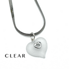 A silver snake chain necklace with a frosted clear heart-shaped pendant featuring a small silver heart in the center, shown on a white background with the word 'CLEAR' printed in the lower left.