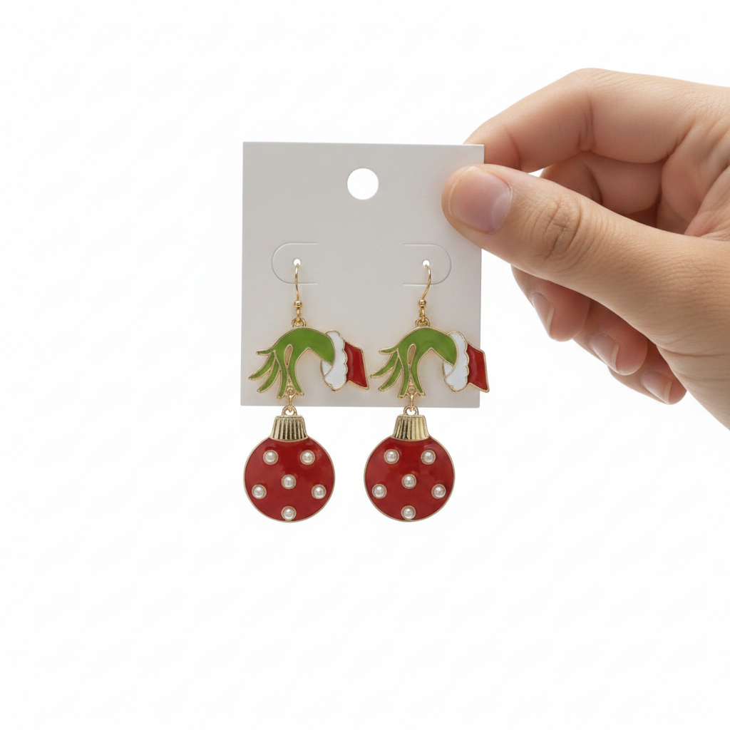 Grinch Christmas ornament dangle earrings in red with pearl accents on white background